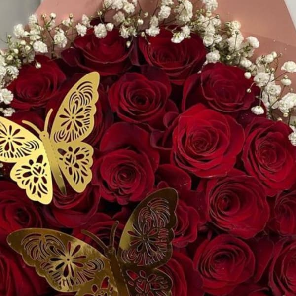 Bouquet of red roses with white baby's breath and gold butterfly accents