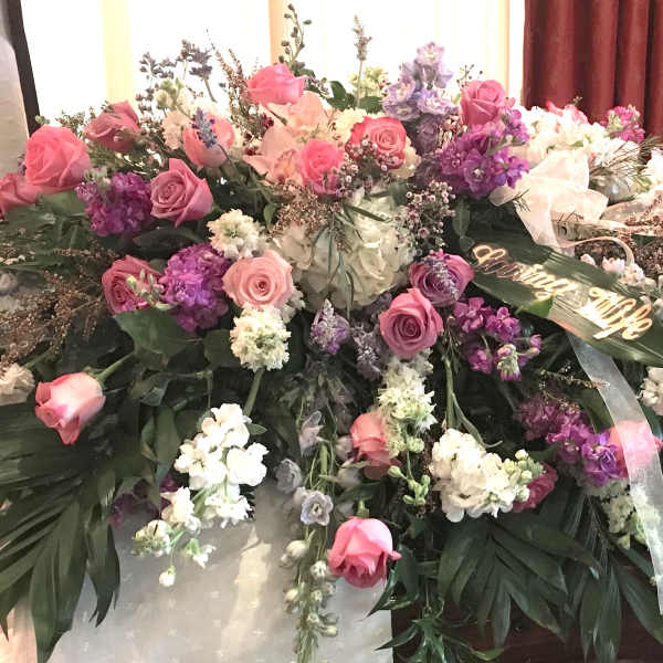 Large floral spray with pink and purple roses and white blooms