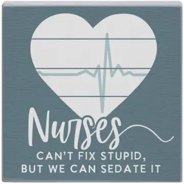Decorative sign with a heart and the word Nurses
