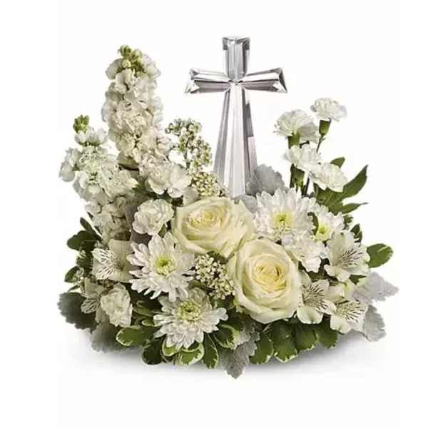 White floral arrangement with a silver cross centerpiece
