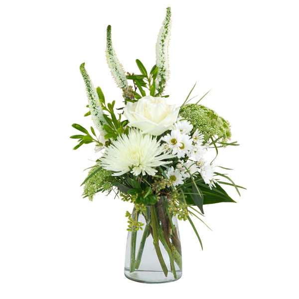White floral arrangement in a clear glass vase