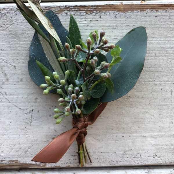 Small boutonniere with eucalyptus and a brown ribbon tie