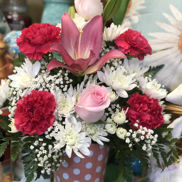 Pink and white mixed bouquet in a polka-dot container