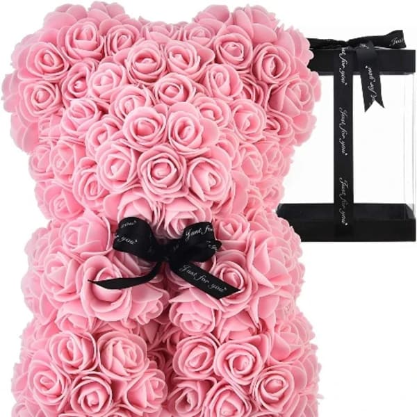 Pink rose teddy bear with a black ribbon bow
