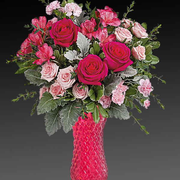 Pink and pale rose bouquet in a tall textured vase