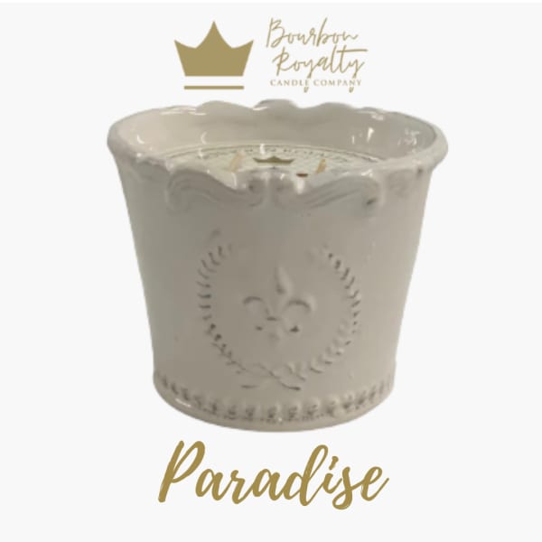 Cream ceramic candle jar with gold "Paradise" text
