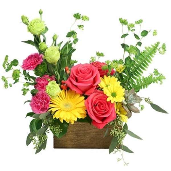 Mixed bouquet of pink roses, yellow daisies, and green blooms in a wooden box