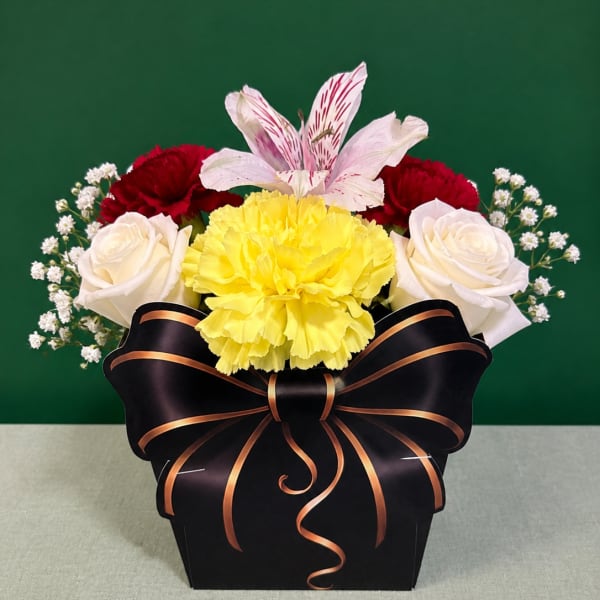 Mixed bouquet in a black gift box with a ribbon bow