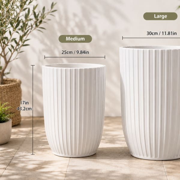 Two white ribbed ceramic planters in different sizes