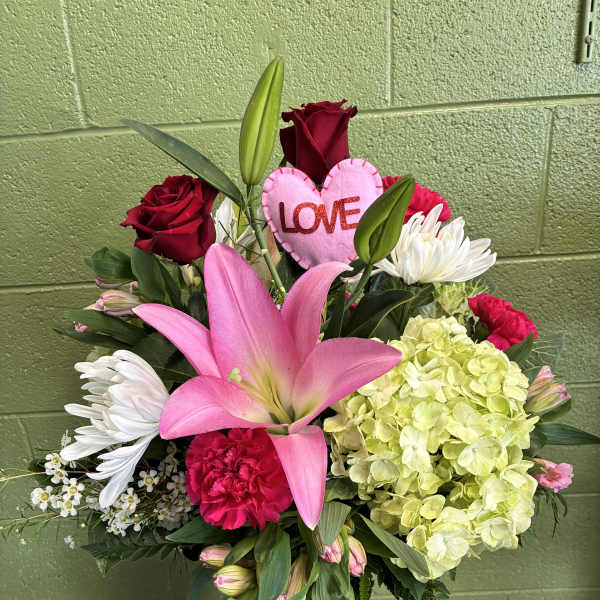 Pink lily and red rose arrangement with a heart-shaped LOVE pick