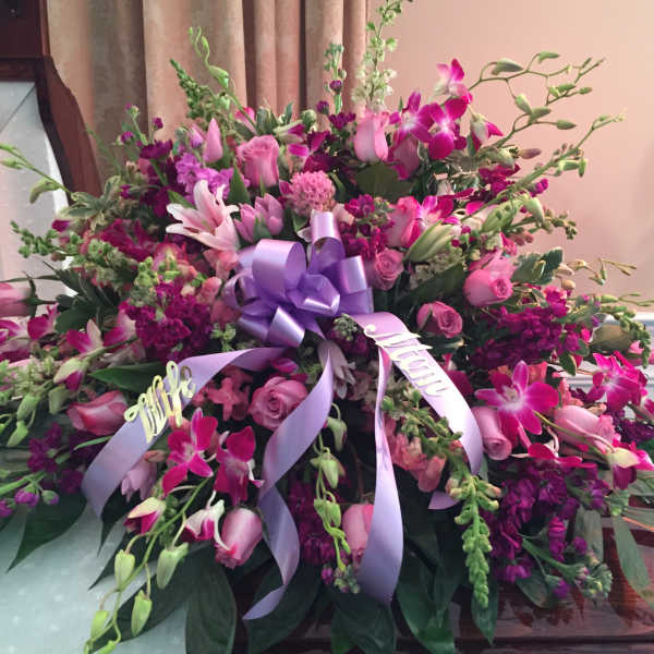 Large pink and purple floral spray with lavender ribbons