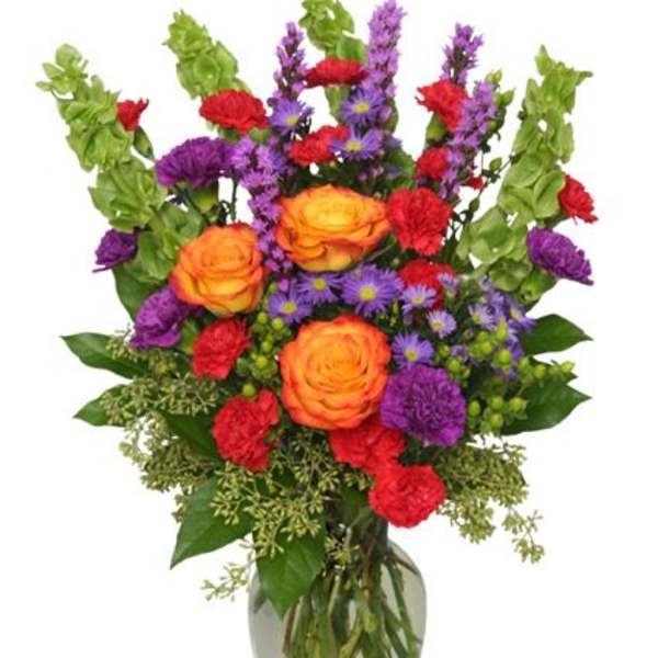 Colorful mixed bouquet in a clear glass vase