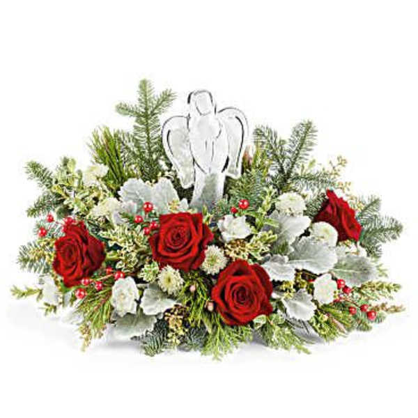Red roses and white flowers arranged with an angel ornament