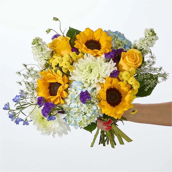 Handheld bouquet with sunflowers, yellow roses, hydrangeas, and white chrysanthemums