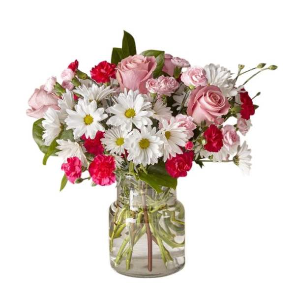 Pink roses and white daisies arranged in a clear glass vase