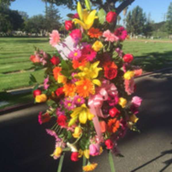 Large colorful floral standing arrangement outdoors