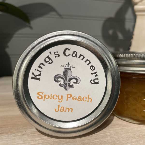 Two jars of spicy peach jam with silver lids