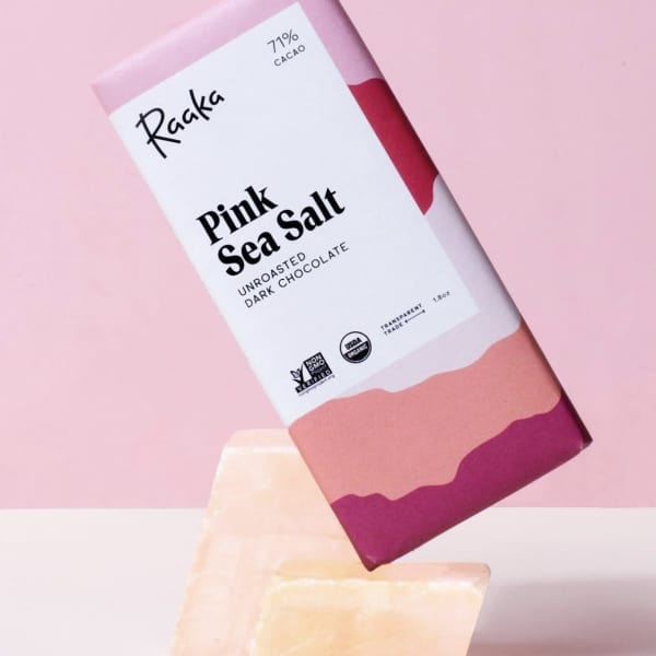 Pink sea salt dark chocolate bar on a pink background