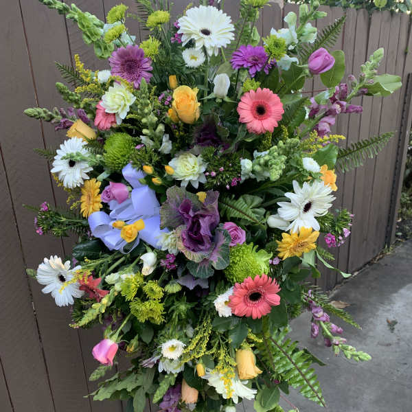 Tall mixed flower standing spray with gerberas, roses, and snapdragons