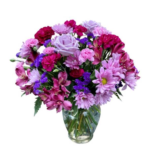 Mixed pink and lavender bouquet in a clear glass vase