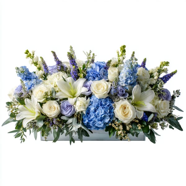 Blue and white floral arrangement in a rectangular box