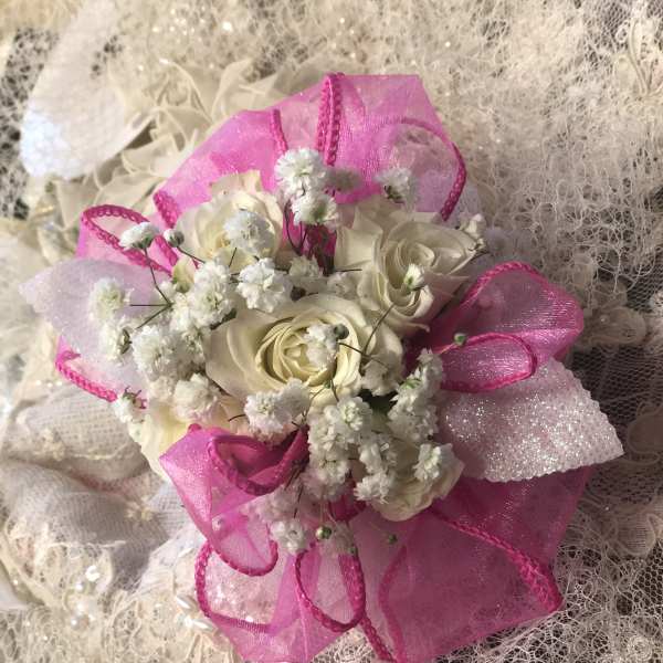 White rose bouquet with bright pink ribbon and lace wrap