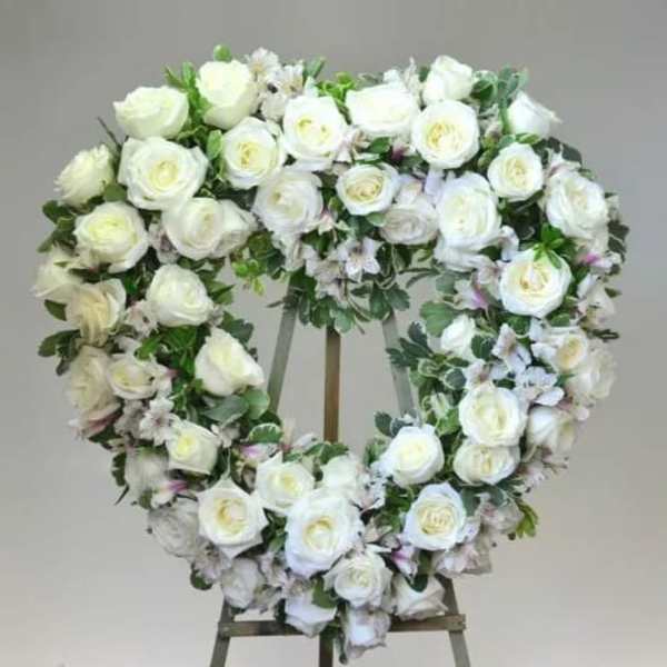 White rose wreath on a standing easel