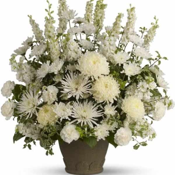 White floral arrangement in a brown vase
