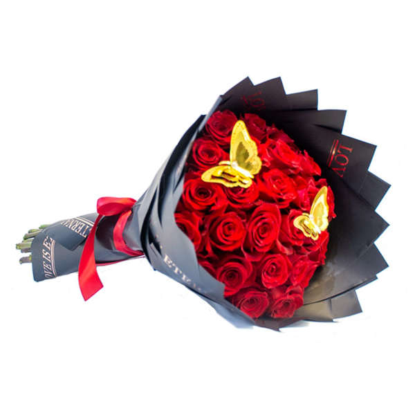 Bouquet of red roses wrapped in black paper with gold butterfly accents