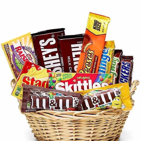 Basket filled with assorted candy bars and chocolate packs