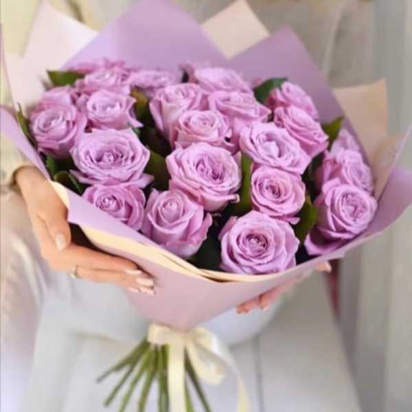 Bouquet of lavender roses wrapped in pastel paper