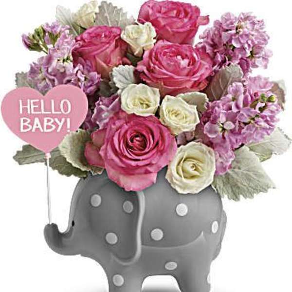 Pink and white roses in a gray elephant vase with a "Hello Baby!" heart pick