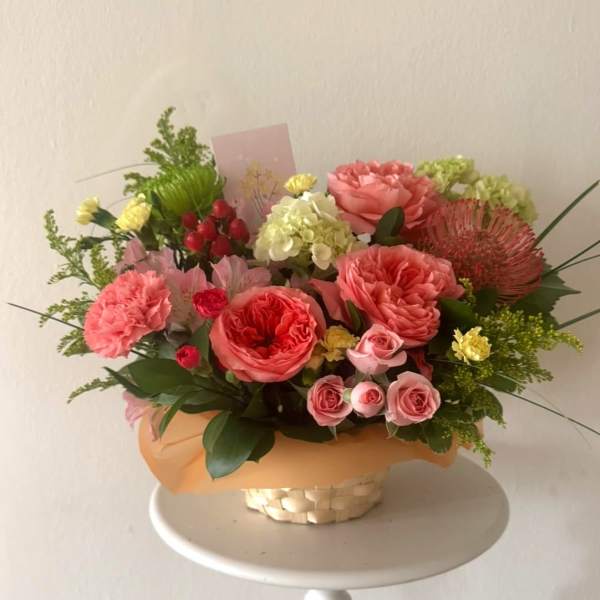 Coral Glow basket -Garden rose, Chrysanthemum, Solidago, Hydrangea.