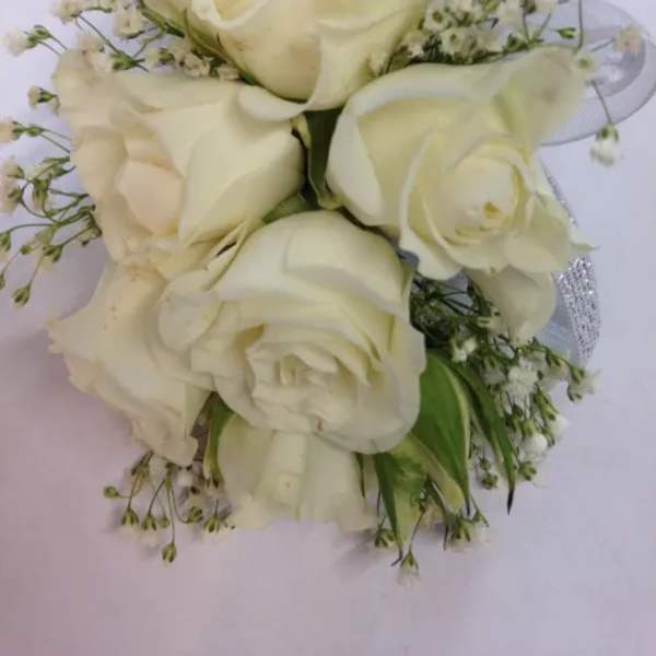 White rose bouquet with small filler flowers
