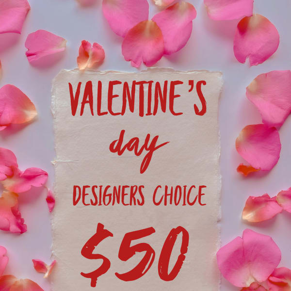 Pink rose petals around a Valentine’s Day sign with $50 text