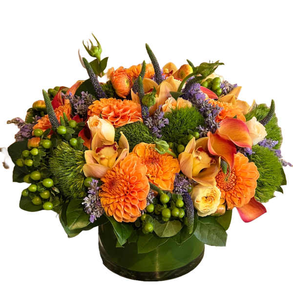 Orange and peach floral arrangement in a green glass vase
