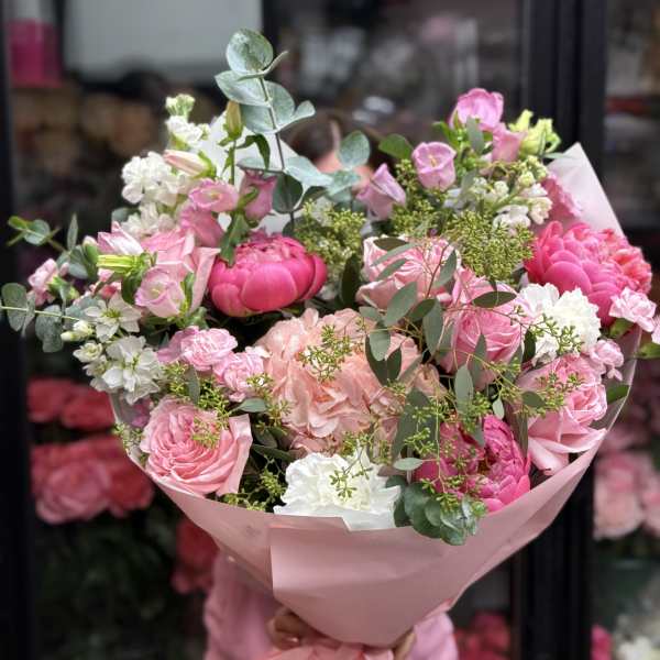 Pink and white mixed bouquet wrapped in pink paper