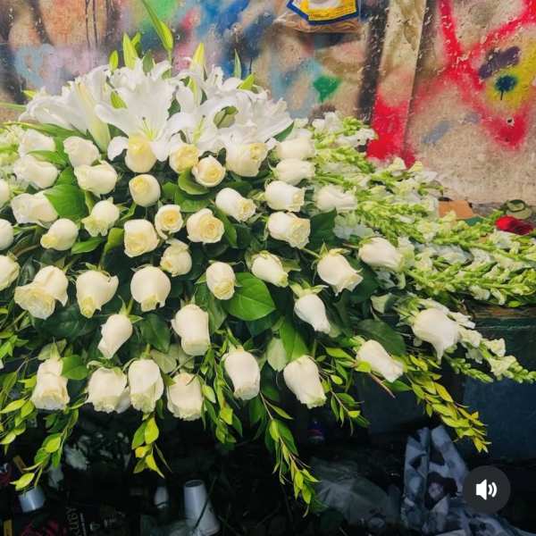Large white floral spray with roses and lilies