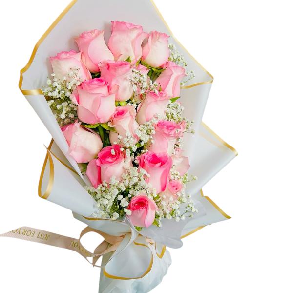 Bouquet of pink roses with white baby's breath in white wrapping