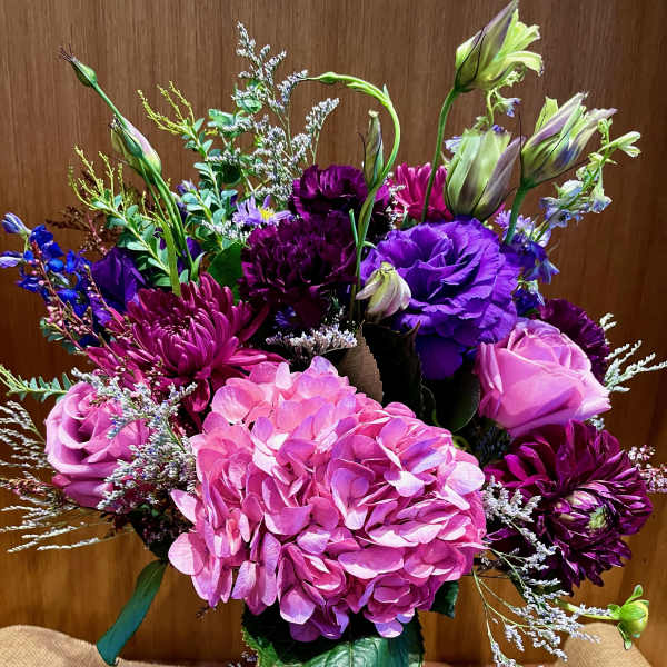 Bouquet of pink and purple flowers in a glass vase