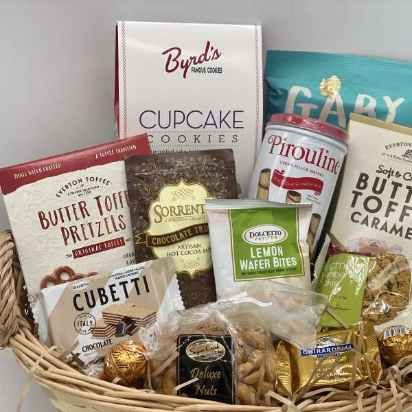 Basket of assorted cookies, candies, and snack packs
