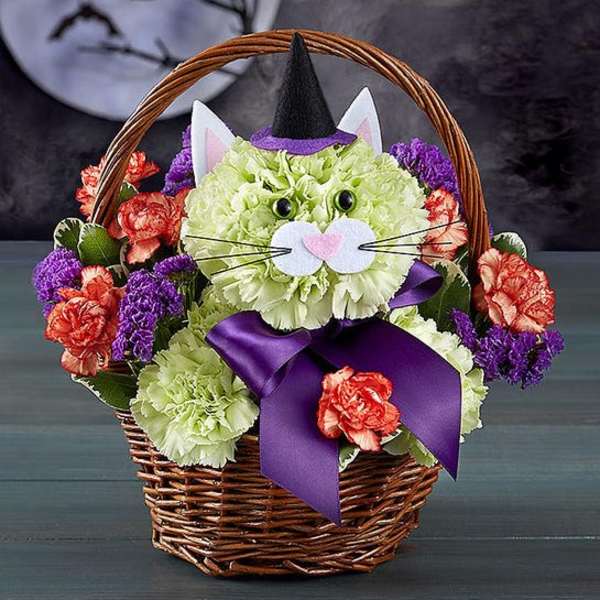 Cat-shaped flower basket with purple ribbon and a witch hat