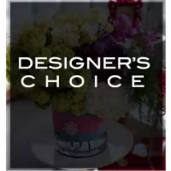 Designer’s Choice floral arrangement in a container