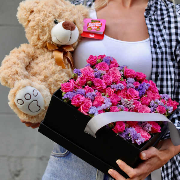 Pink rose bouquet in a black box with a teddy bear