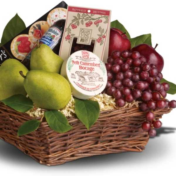 Fruit and cheese gift basket in a wicker tray