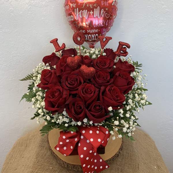Red rose arrangement with a heart balloon and LOVE picks