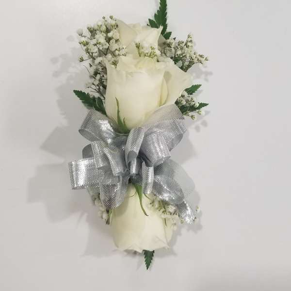 White rose bouquet with baby's breath and a silver ribbon