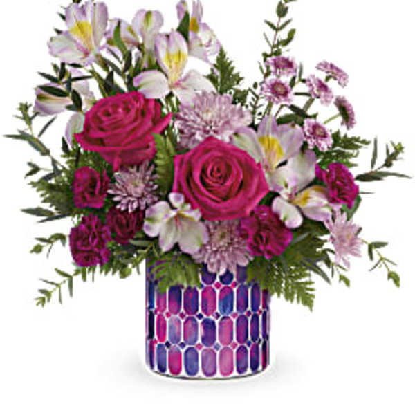 Pink roses and white alstroemeria in a patterned vase