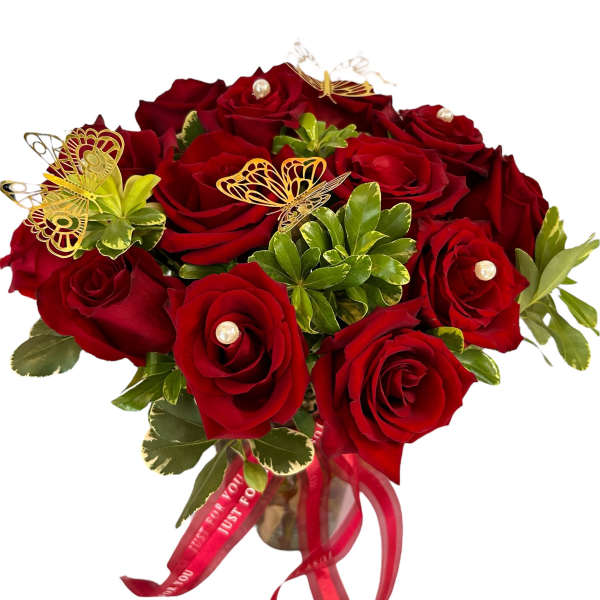 Bouquet of red roses with butterfly picks and a red ribbon