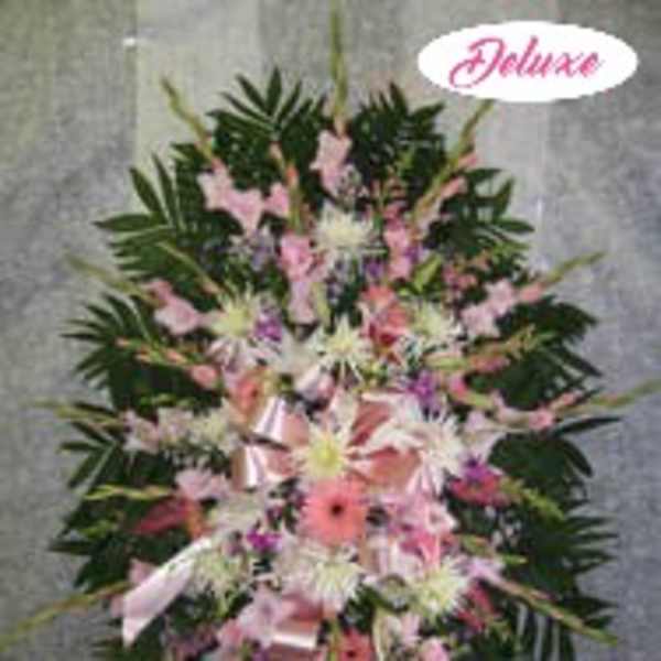 Pink and white floral standing spray with ribbon accents